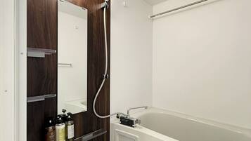 Economy Apartment, Balcony | Bathroom | Combined shower/tub, hair dryer, slippers, towels