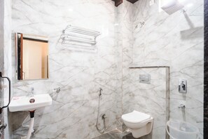 Family Quadruple Room | Bathroom | Shower, free toiletries, towels, soap - Travinities Hotel - The Royal Palace (Indore)
