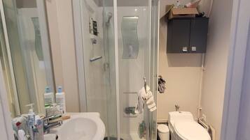 Shower, towels, soap, toilet paper