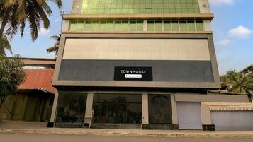 A building with a sign reading 'TOYNHOUSE' and a glass facade.