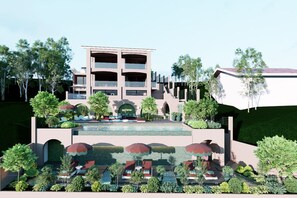 A modern hotel with a pool, outdoor seating, and lush landscaping. - Villa Verdejo, luxury 2-bedroom & 2 bathroom apartment, with balconies & pool (Olivella)