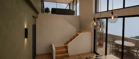 A modern interior with a staircase leading to a balcony, a dining area with a table and chairs, and a large window offering a view.