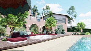 Uma área moderna de piscina ao ar livre, com espaço para sentar, piscina e um edifício com design arquitetônico singular.