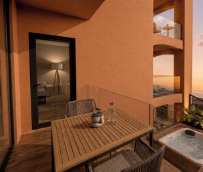 A wooden table with chairs and a potted plant on an outdoor balcony with a view of the sunset. - Villa Verdejo Sitges · Luxury 8-Bedroom, 9-Bathroom Villa with Pool & Spa (Olivella)