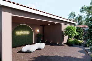 A modern building entrance with a sign reading 'Villa Verdejo Sitios.' - Villa Verdejo Sitges · Luxury 8-Bedroom, 9-Bathroom Villa with Pool & Spa (Olivella)