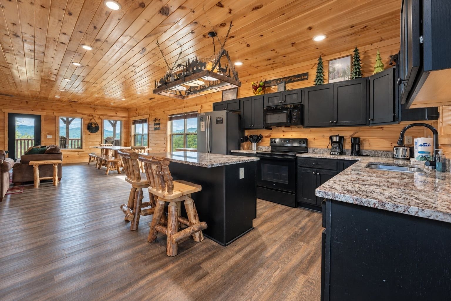 A wooden interior with a kitchen, dining area, and bar seating.