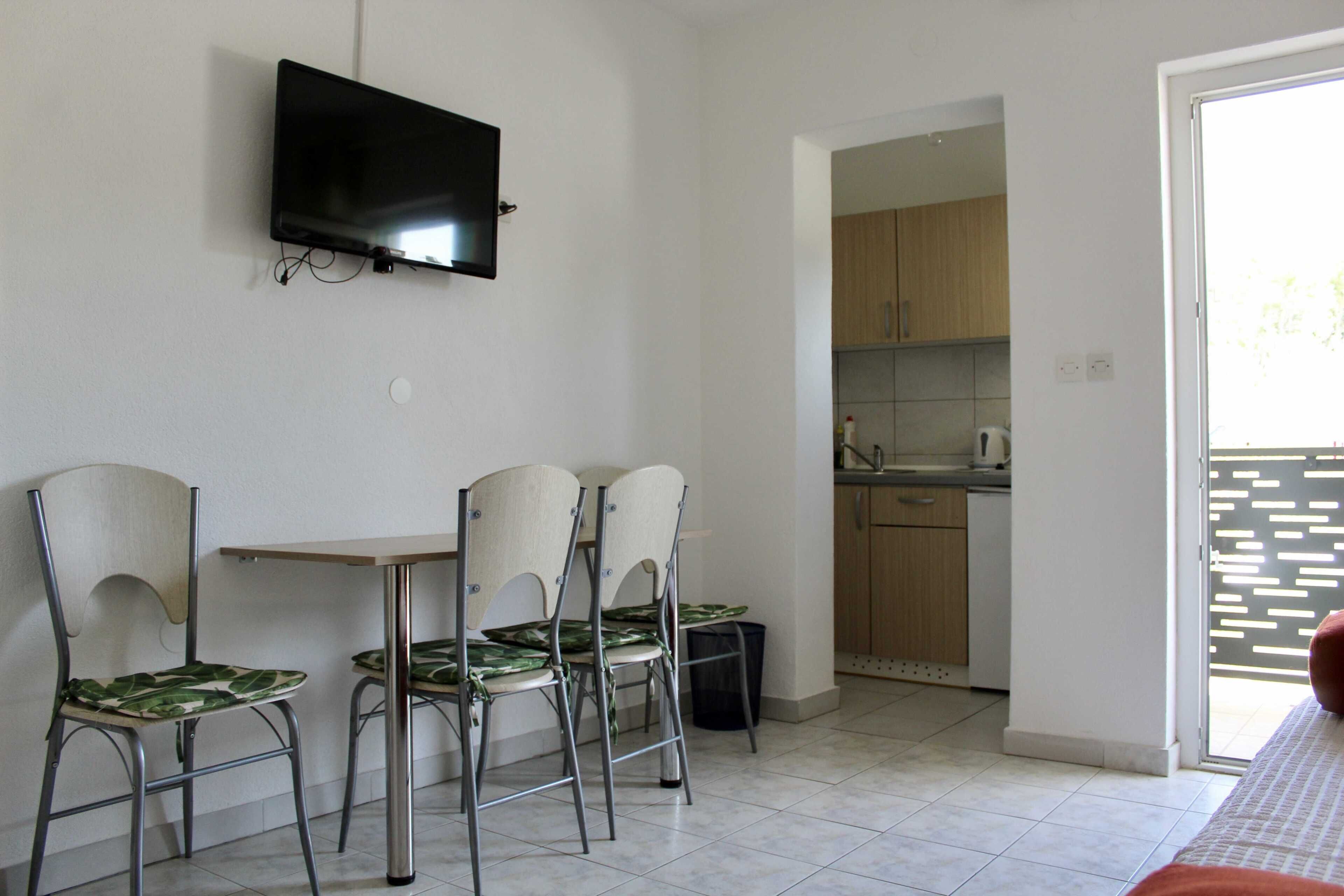 Apartment (One Bedroom Apartment with Balcony an) | Living room | 32-inch flat-screen TV with satellite channels