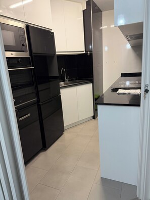 Private kitchen - La Casa de la Calma de Santiago - Apt & Wellness (O Milladoiro)