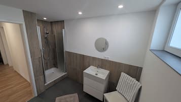 Shower, towels, soap, toilet paper