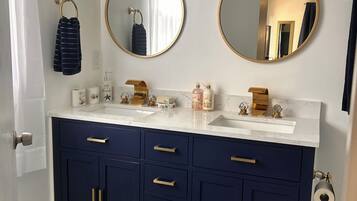 Shower, towels, soap, toilet paper