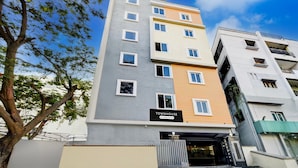 A multi-story building with a sign reading 'TOWNHOUSE.' - Deluxehotel Lanco Hills (Hyderabad)