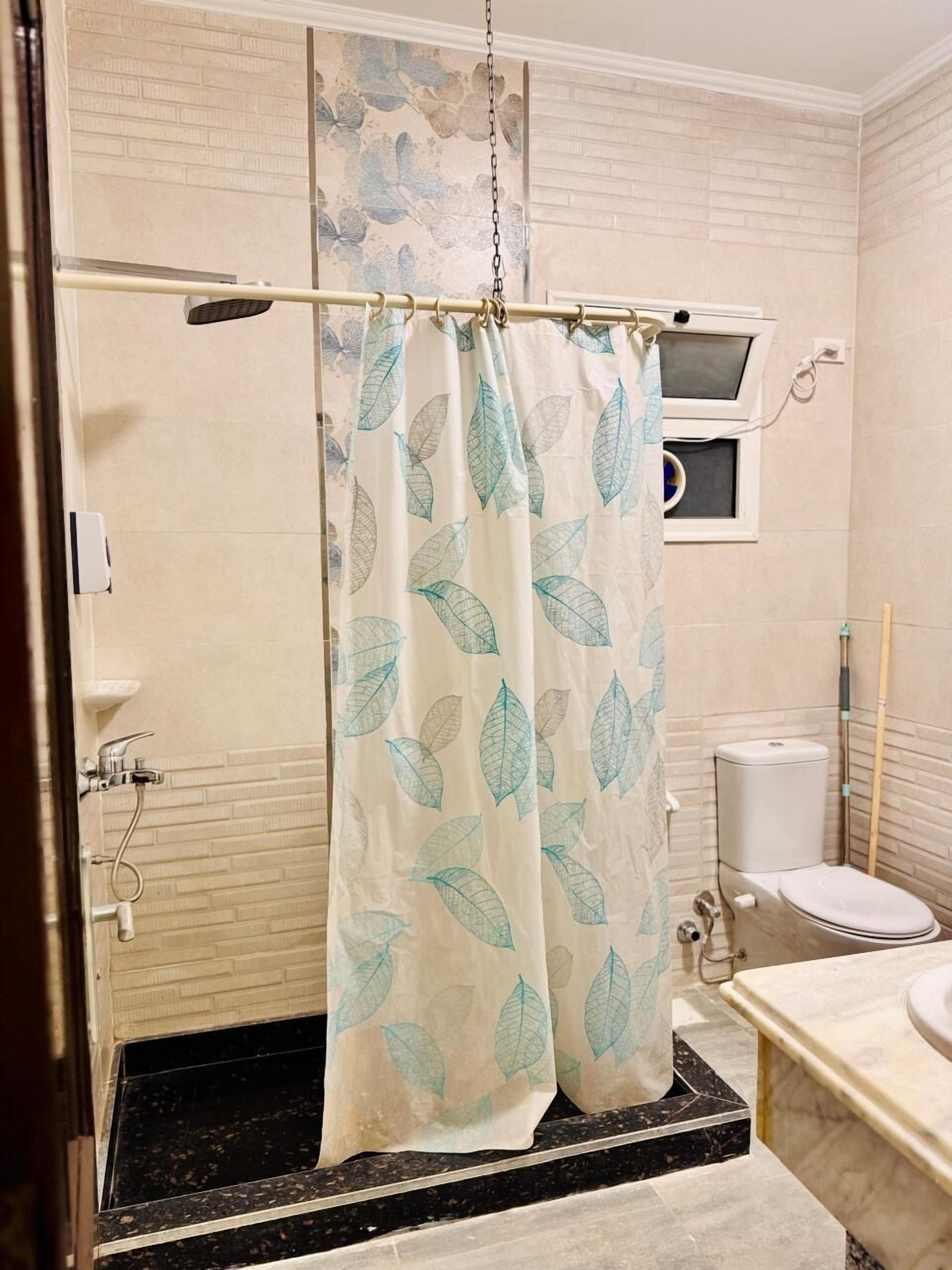 Shower, towels, soap, toilet paper