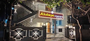 A building with a sign reading 'Akshaya COMFORTS' and a gated entrance. - AKSHAYA COMFORTS (Visakhapatnam)