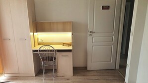 A bedroom with a wooden desk, a chair, a bed, and a wardrobe. - By trails and parks, near cafés, 25 min from Energylandia. (Bielsko-Biała)