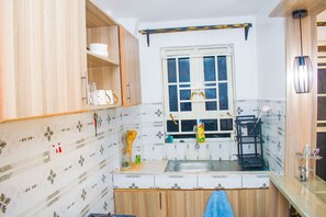 Microwave, stovetop - A serene 1-bedroom apartment in Nairobi for your stay. (Nairobi)
