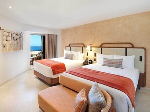 A hotel room with two beds, a wooden bench, and a view of the sea. - Luxury 2 bed 2 bath with optional pull out. In the heart of Cabo San Lucas. (Cabo San Lucs)