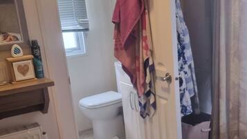 Combined shower/bathtub, deep-soaking bathtub, hair dryer, towels