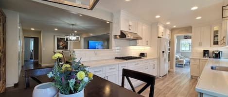 Fridge, coffee/tea maker, cookware/dishes/utensils