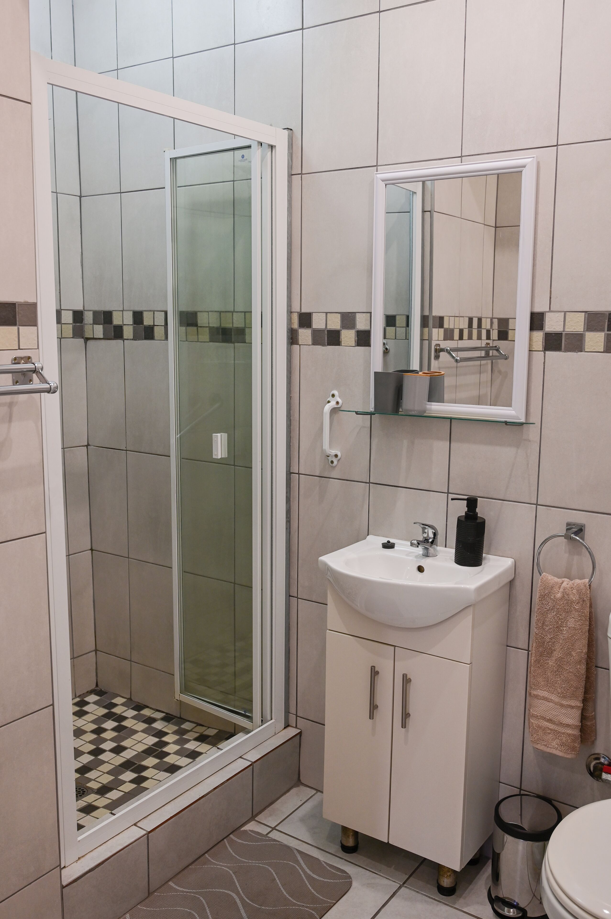 Shower, towels, soap, toilet paper