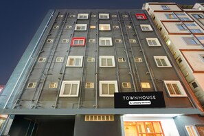 A multi-story building with a sign reading 'TOWNHOUSE Company-Serviced.' - Deluxetownhouse Sarjapur Near Bellandur (Bengaluru)