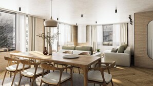 Ein modernes Wohnzimmer mit einem Holzespeisetisch, Stühlen, einer Couch und einem großen Fenster mit Blick.