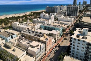 A coastal urban area with buildings, a beach, and a clear sky. - Cozy South Beach 1BR Near Beach & Nightlife 310 (Miami Beach)