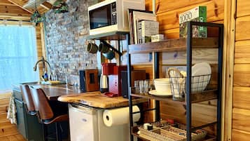 Coffee/tea maker, fridge, microwave, cookware/dishes/utensils