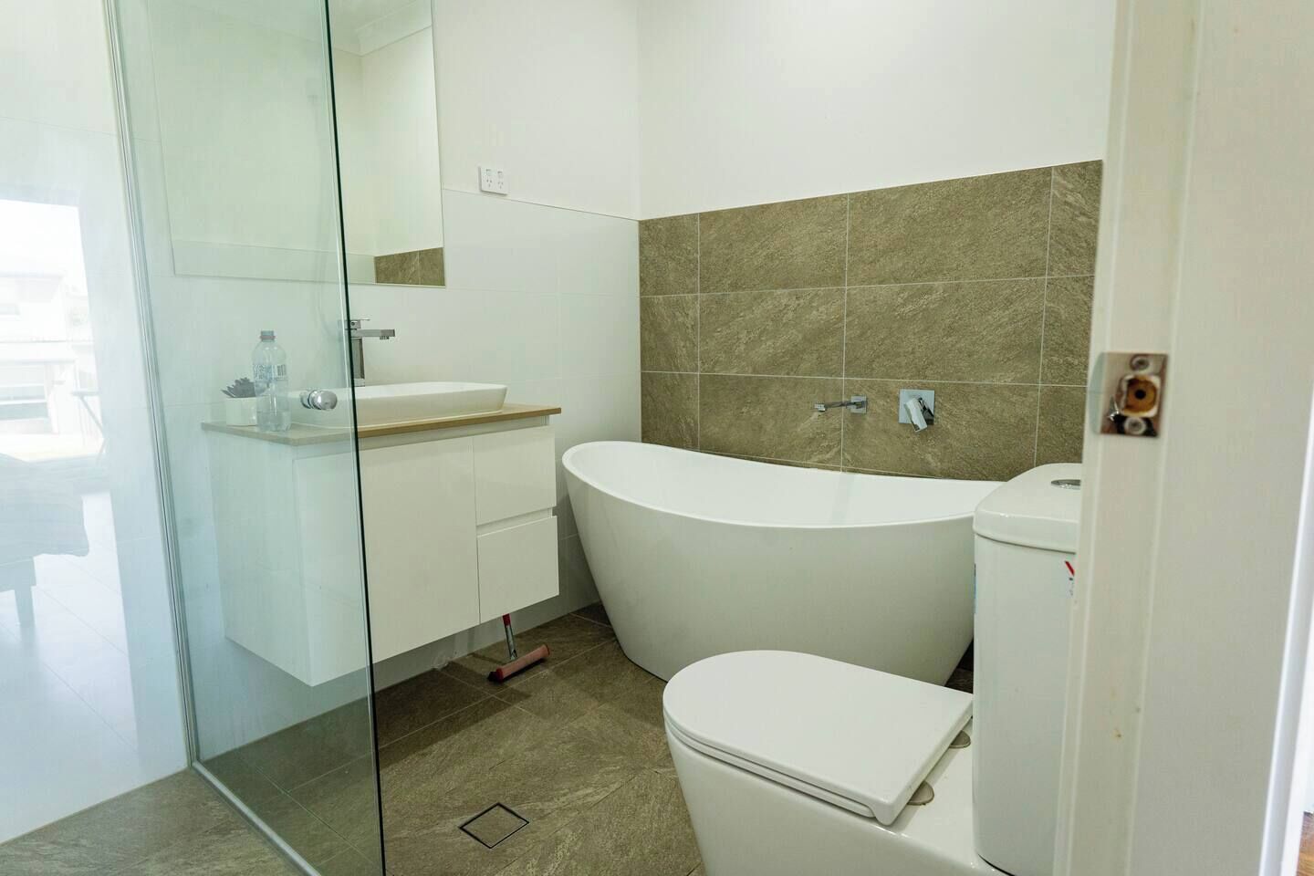 Shower, towels, soap, toilet paper