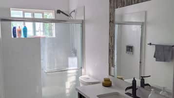 Shower, hair dryer, towels, toilet paper