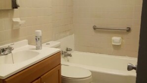 A bathroom with a toilet, sink, and bathtub. - 4BR Home Minutes from Mercedes‑Benz Stadium — FIFA 2026 Full‑Event Rental (Atlanta)