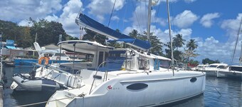 Shared catamaran anchored in anse mitan bay at trois ilets