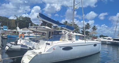 Shared catamaran anchored in anse mitan bay at trois ilets