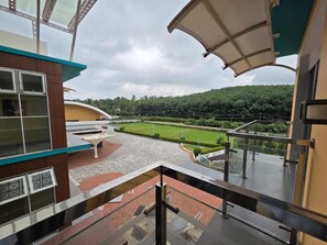 Deluxe Twin Room, Balcony, Garden View | Property grounds - PetRose Business Hotel (Kunnathunad)