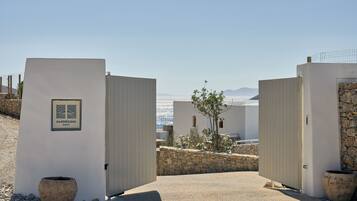A gated entrance to a property with a sign reading 'AMORGINA RESORT'.