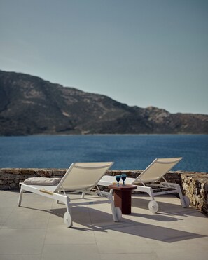 Seasonal outdoor pool, open 10:00 AM to 8:00 PM, pool umbrellas