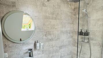 Shower, hair dryer, towels, soap