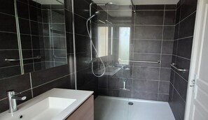 Shower, hair dryer, towels, toilet paper