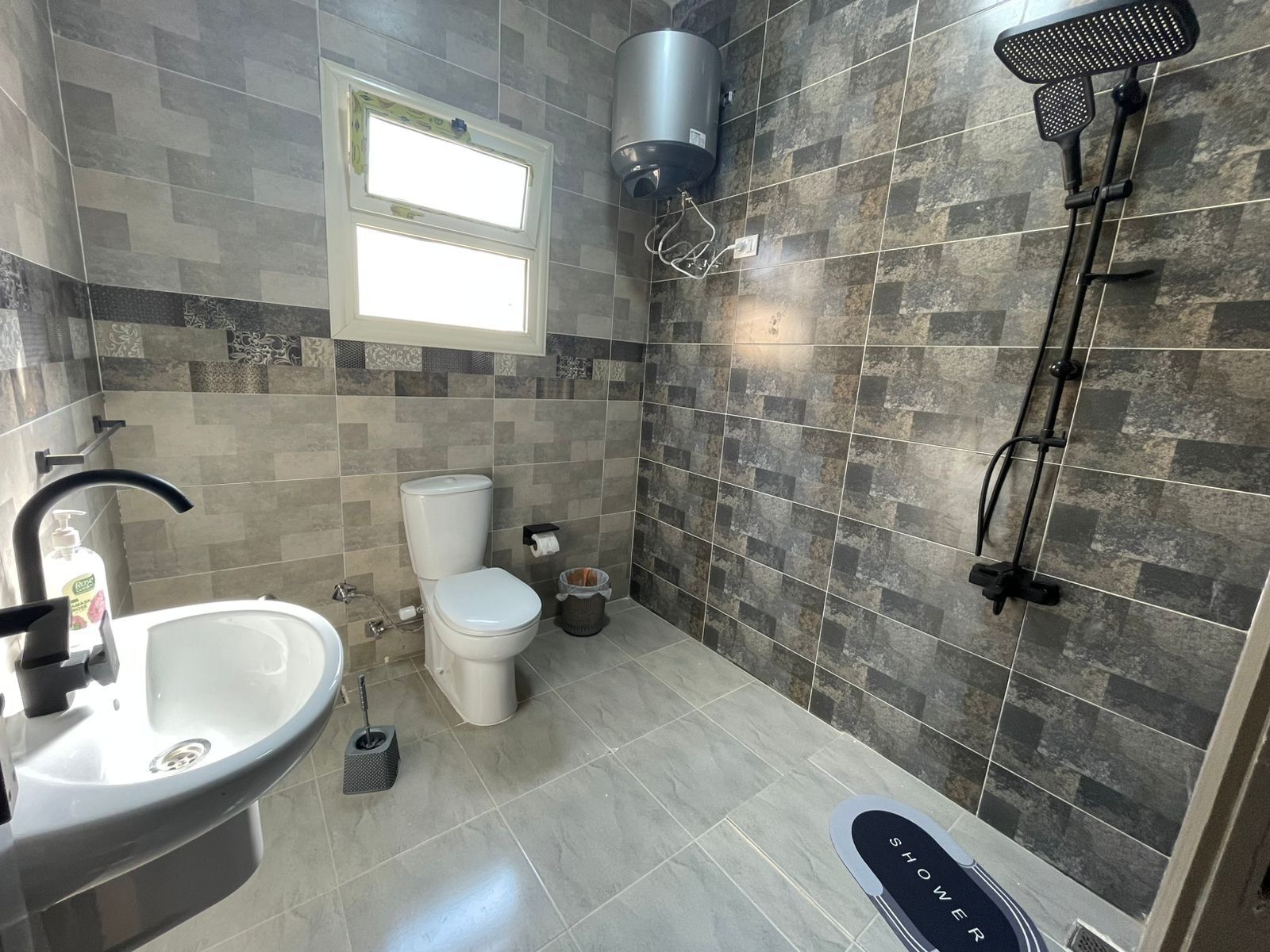 Shower, towels, soap, toilet paper