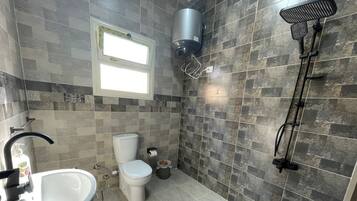 Shower, towels, soap, toilet paper