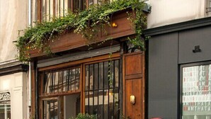 A building with a wooden facade, large windows, and a sign reading 'STUDIO WALDORF'. - La Folie Urban Studio R Publique Marais Canal St Martin (Paris)
