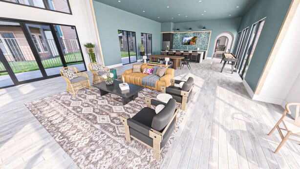A spacious living area with a sofa set, coffee table, and chairs, a kitchen area with a dining table, and large windows offering views.
