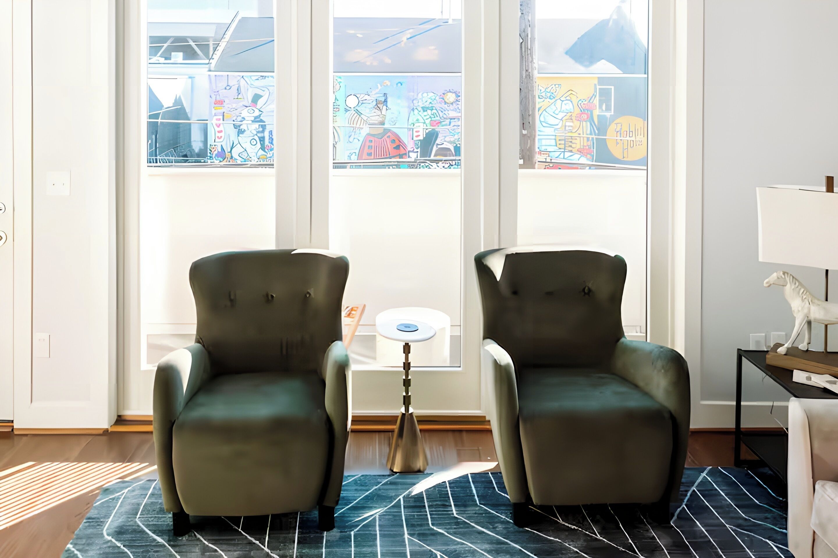 Relax in these two deep emerald green velvet armchairs perfectly positioned by the window. It is the best spot in the house to enjoy the sunlight and a good book.