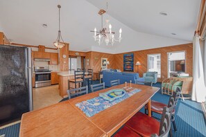 A compact living space with a kitchen, dining area, and seating area. - JL #656 | Terrill Cottage | Semi-Oceanfront | Horizon Ocean View (Kitty Hawk)