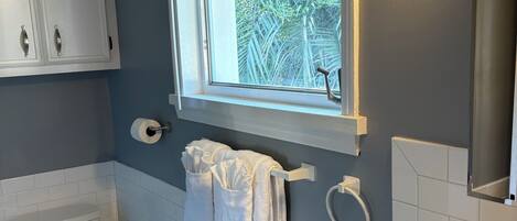 Shower, towels, soap, toilet paper