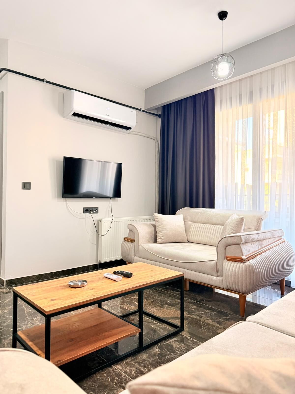 Deluxe-Apartment, Balkon, Gartenblick | Wohnbereich