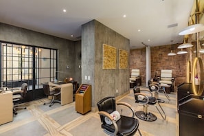 A salon with multiple hairdressing stations, a reception desk, and a large window with a view. - 1 bedroom suite at Beautiful Hacienda Encantada (El Paraje)