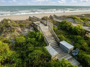 A wooden staircase leading to a beach with a view of the ocean. - Soundside Solace 5BR w/ Elevator + Dock Views (North Topsail Beach)