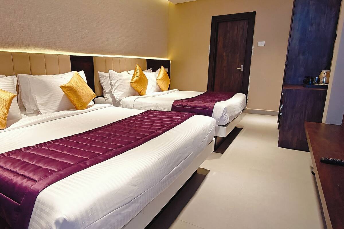 Kamar Quadruple Keluarga | Seprai premium, selimut bulu angsa, dan tempat tidur Select Comfort