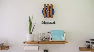 A wall-mounted shelf with a potted plant, a toaster, and a clock.