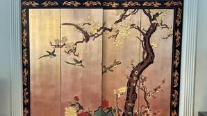 A room with a traditional sliding door featuring a nature scene. - Mountain Quest Inn (Marlinton)